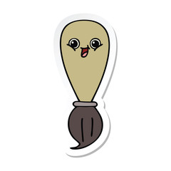 sticker of a cute cartoon paint brush