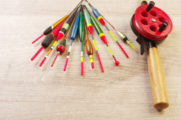 Fishing floats and fishing gear on a wooden table © yrafoto