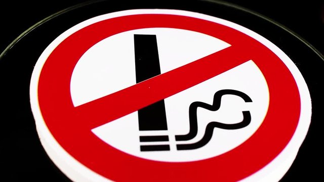 Don't smoking do not smoke sign closeup texture video on rolling rotating looping plate