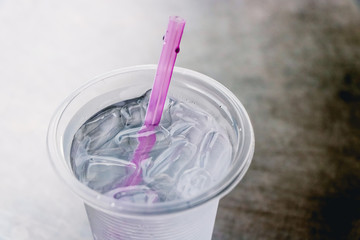 Water in the glass on stainless steel table. Top view with copy area.