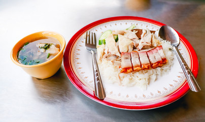 Chicken rice on a stainless steel table. Top view with copy area.