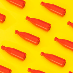 Sauce ketchup in plastic bottle on a yellow background. The concept of minimalism. Breakfast meal pattern.