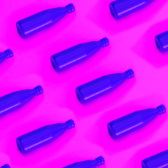 Blue sauce ketchup in plastic bottle on a pink background. The concept of minimalism. Breakfast meal pattern.