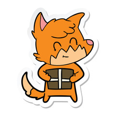 sticker of a cartoon friendly fox with gift