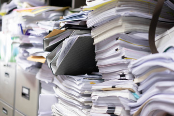 Many filing cabinets in a messy office without mess.
