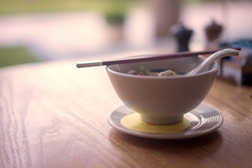 Hot pork soup in the breakfast on the table in the dining room