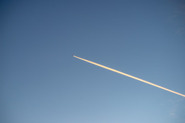 plane leaving smoke trail in the sky