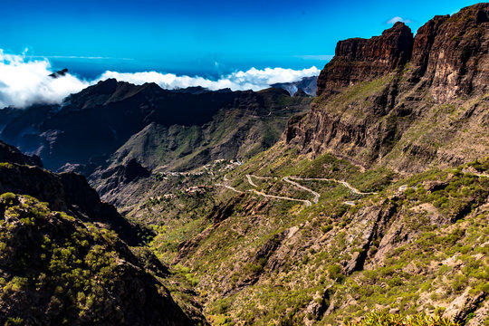 Tenerife, Canary Islands, Spain - The winding mountain road, the mountainous landscape inland on the coast in the west, on the island of Tenerife, on a sunny day in October.