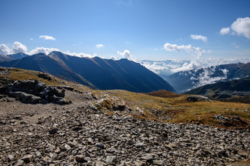 Fototapeta na wymiar Tatra mountain peaks with tourist hiking trails in sunny summer day