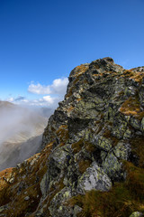 Tatra mountain peaks with tourist hiking trails in sunny summer day