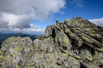 Tatra mountain peaks with tourist hiking trails in sunny summer day