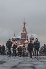 A tourist uses his smartphone to take a picture of famous St. Basil's Cathedral at Red Square in Moscow, Russia