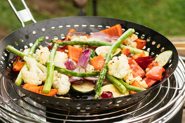 Mixed vegetables being grilled on a table grill