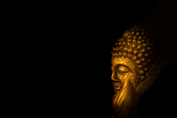 bronze colored idol of lord buddha