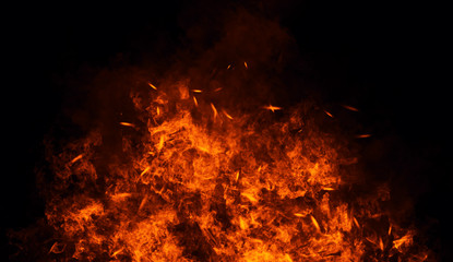 Fototapeta na wymiar Fire, heat, passion, texture. Fire particles embers background . Design element.