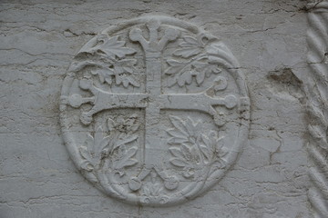 Ancient coat of arms carved in stone.