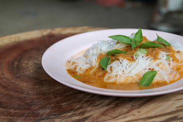 Traditional Thai cuisine, rice vermicelli eaten with green curry.