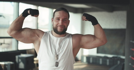 Portrait of a Strong, muscular man, Apollo shows his muscles, torso, vein Delta press