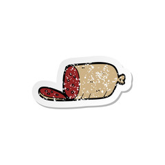 retro distressed sticker of a cartoon sliced sausage