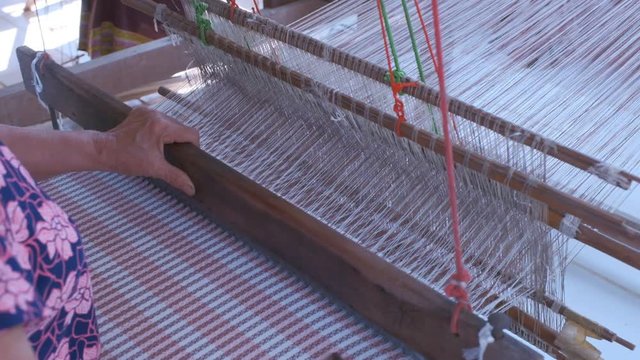 Process of Thai cloth weaving in the production of Thai textiles in countryside, Home made traditional thai lue (north of thailand)