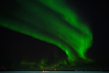 Northern lights (Aurora borealis) with starry sky above forest, Yellowknife, Canada