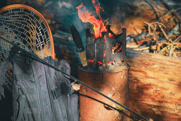 Firebox stove in the camp during fishing.