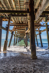 Looking out to sea from underneath the pier, at San Clemente, California