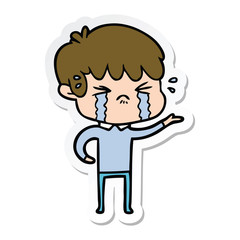 sticker of a cartoon boy crying