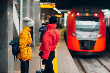 Young female and railway train.