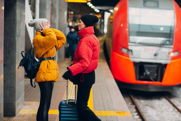 Young female and railway train.
