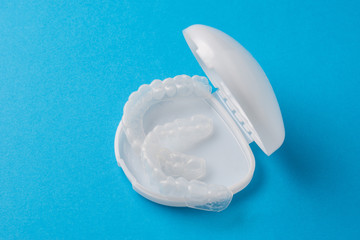 Plastic cap for teeth in a white case