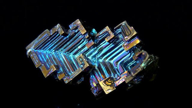 Seamlessly rotating a colorful mineral (Bismuth) in front of black background