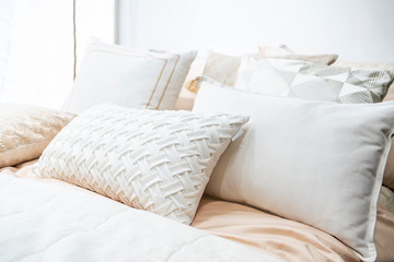 Fototapeta na wymiar Bedroom bed quilt and pillow interior soft design
