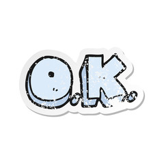 retro distressed sticker of a cartoon word OK