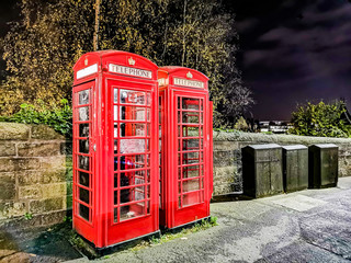 Class Red British Phone both with Edinburgh Castle at night