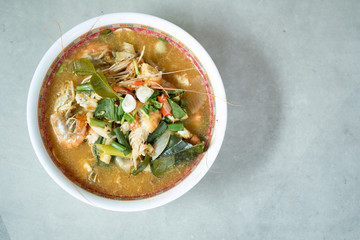 Tom Yum Goong or spicy tom yum soup with prawns shrimps