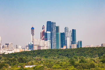 Fototapeta premium architecture,blue,bridge,building,business,center,city,cityscape,construction,design,district,downtown,evening,exterior,finance,financial,futuristic,glass,high,house,international,landmark,landscape,l