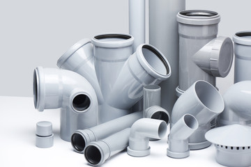 Plumbing, sewage. Gray polypropylene tubes on a white background in futuristic style