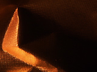 Golden metallic structure. The texture of the foil.