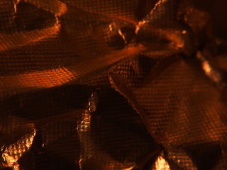 Golden metallic structure. The texture of the foil.