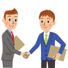 握手をする会社員
