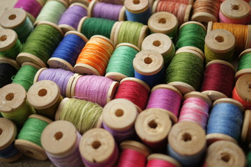 spools of colored thread. multicolored motley background