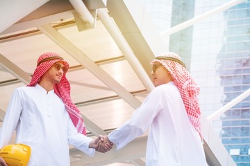 Two Arabian businessman with Successful body language are working together about big project