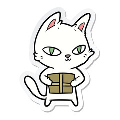 sticker of a cartoon cat holding parcel