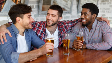 Friends hanging out and communicating in bar