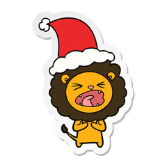 sticker cartoon of a lion wearing santa hat