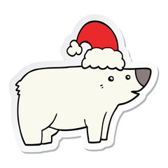 sticker of a cartoon bear wearing christmas hat