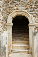 Fototapeta premium Entrance to the ancient Roman amphitheater stone arch staircase. The ancient city of Ephesus Turkey.
