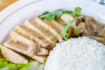 Roasted Pork Rice with Green Vegetables White dish in the morning restaurant.