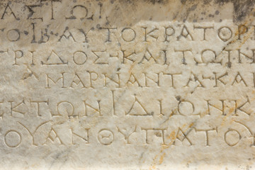 Greek Roman antique old granite stone with inscription of text texture background